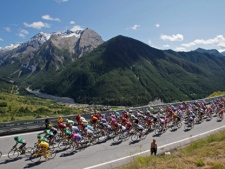 The pack climbs towards Sestrieres pass in Italy during the 17th stage of the Tour de France cycling race Wednesday July 20, 2011. (AP Photo/Christophe Ena)