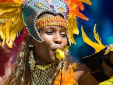 A reveller takes part in the 2010 Caribana Parade in Toronto on Saturday, July 31, 2010. (THE CANADIAN PRESS/Adrien Veczan)