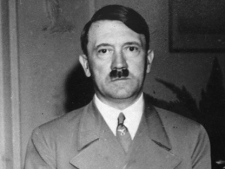 In this Sept. 22, 1938 file photo German dictator Adolf Hitler stands in a room of the hotel Dreesen, in Bad Godesberg, near Bonn, Germany. (AP Photo, File)