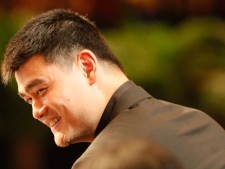 NBA star Yao Ming smiles after he announced his retirement during a press conference in Shanghai, China, Wednesday, July 20, 2011. The Houston Rockets center has made it official, telling the packed news conference in his hometown that a series of injuries have forced him to retire from basketball. (AP Photo/Eugene Hoshiko)