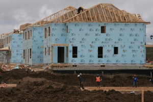 A construction worker works on a house in a new housing development in Oakville, Ont., in this file photo. (The Canadian Press/Richard Buchan)