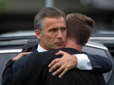 Norway's Prime Minister Jens Stoltenberg, left, embraces the leader of the Labour party's youth group Eskild Pedersen who was on the island during the shooting attacks at Stoltenberg visited survivors at a hotel in Sundvolden, Norway, Saturday, July 23, 2011. The 32-year-old man suspected in bomb and shooting attacks that killed at least 91 people in Norway bought six tons of fertilizer before the massacres, the supplier said Saturday as police investigated witness accounts of a second shooter. Norway's prime minister and royal family visited grieving relatives of the scores of youth gunned down in a horrific killing spree on an idyllic island retreat. (AP Photo)
