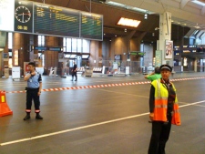 Security officials stand guard as parts of Oslo's main railway station, Oslo S, were closed and evacuated early Wednesday, July 27, 2011, after a suitcase with no apparent owner was discovered on one of the platforms. (AP Photo/Scanpix, Ole-Tommy Pedersen)