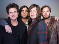 In this Oct. 21, 2010 file photo, members of the band Kings of Leon, from left, Jared Followill, Nathan Followill, Matthew Followill and Caleb Followill, pose for a portrait in New York. The Kings of Leon promised Sunday, July 31, 2011, to make it up to their Dallas fans after they canceled a show when their lead singer complained it was too hot to perform. In a statement, the band announced plans to return to Dallas on Sept. 21. (AP Photo/Victoria Will, File)