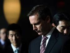 Dalton McGuinty, Premier of Ontario, front, walks in with associates from Korea at a press conference before signing an agreement that will bring more green energy to Ontario on Thursday, Jan. 21, 2010 in Toronto. (THE CANADIAN PRESS/Nathan Denette)