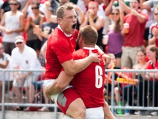 Team Canada's Phil Mackenzie, left, and Jebb Sinclair celebrate after scoring a try during an international rugby test match against Team USA at BMO Field in Toronto Saturday, August 6, 2011. THE CANADIAN PRESS/Darren Calabrese