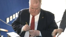 Mayor Rob Ford signs bobbleheads