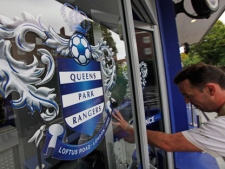 A fan arrives to buy a ticket at the Queens Park Rangers football ground, in west London, Tuesday Sept. 22, 2009. (AP Photo/Lefteris Pitarakis)