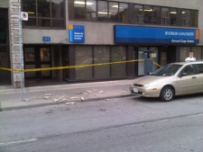 Pieces of concrete that fell from the building at 111 Gerrard St. E. on Aug. 14 line the sidewalk.