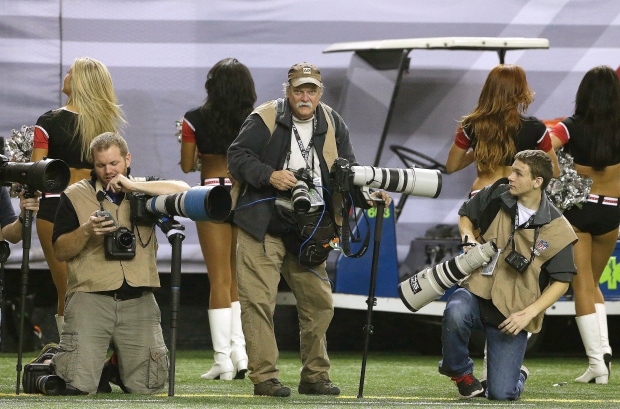 Photographer dies after collapsing on field