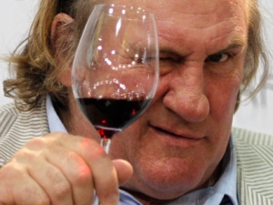 In this Sept 12, 2010 file picture, French actor Gerard Depardieu tests a glass of wine during a gastronomy fair in Duesseldorf, Germany. French actor Gerard Depardieu was unable to control his bladder ahead of a Paris-Dublin flight and urinated on himself aboard the plane, a passenger on the flight told French radio Wednesday Aug. 17, 2011.(AP Photo/ Roberto Pfeil/dapd)