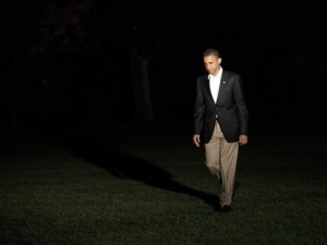 President Barack Obama walks across the South Lawn of the White House following his arrival on Marine One helicopter, Wednesday, Aug., 17, 2011, in Washington. (AP Photo/Pablo Martinez Monsivais)