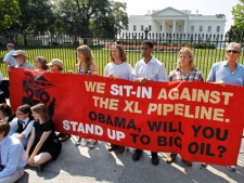 Protestors over a proposed pipeline to bring tar sands oil to the U.S. from Canada, gather in front of the White House in Washington, Saturday, Aug. 20, 2011. (AP Photo/Manuel Balce Ceneta)