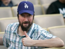 Actor and comedian Tom Green gives a thumbs up at Dodger Stadium before the Major League Baseball game between the Los Angeles Dodgers and the Florida Marlins, Saturday, July 25, 2009, in Los Angeles. (AP Photo/Danny Moloshok)