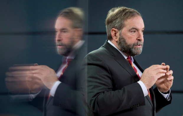 NDP leader Tom Mulcair speaks with the media during an end of session availability on Wednesday, Dec. 18, 2013 in Ottawa. (The Canadian Press/Adrian Wyld)