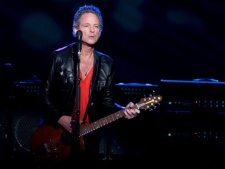 In this March 19, 2009 photo, Lindsey Buckingham of Fleetwood Mac performs at Madison Square Garden in New York. Buckingham says the band is likely to tour and record a new album soon. (AP Photo/Charles Sykes)