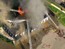 Firefighters battle a blaze at a restaurant in Bowmanville on Monday, Aug. 29, 2011.