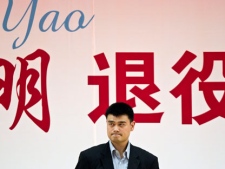 NBA basketball star Yao Ming reacts during an official ceremony to mark his retirement in Beijing Monday, July 25, 2011. Yao has made it official, telling the packed news conference in his hometown that a series of injuries have forced him to retire from basketball. (AP Photo/Alexander F. Yuan)