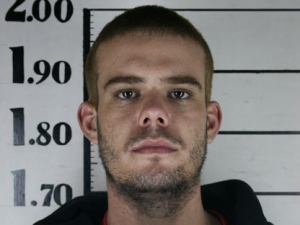 In this file photo taken June 11, 2010 and obtained by The Associated Press via Peru's America Television channel, Dutch citizen Joran van der Sloot holds his inmate number before been transferred to the Miguel Castro Castro prison in Lima. Under an agreement signed Thursday, May 12, 2011 Dutch murder suspect Joran van der Sloot could serve part of his sentence in the Netherlands if he is convicted of murdering a Peruvian student nearly a year ago. The foreign ministers of the two countries agreed that Dutch prisoners in Peru and Peruvians jailed in the Netherlands can apply to complete their prison terms in their homeland once their appeal process has been completed. (AP Photo/America Television Channel, Domingo al Dia)