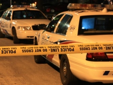 A Toronto police car is parked near the scene of a shooting on Windsor Road, near Dixon Road and Kipling Avenue, on Wednesday, Aug. 31, 2011. An 18-year-old man was shot in the leg.