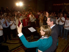 Ontario Premier Dalton McGuinty and his wife Terri wave to supporters after releasing the Liberal party platform at an event on Monday September 5, 2011 in Toronto. THE CANADIAN PRESS/Frank Gunn