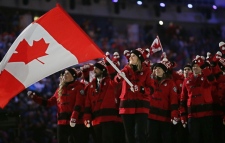Hayley Wickenheiser carries Canada's flag