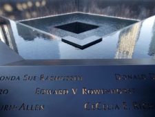 Names of those killed on 9/11 are inscribed around a memorial pool at the National September 11 Memorial at the World Trade Center site in New York before a ceremony marking the 10th anniversary of the attacks on the trade center, Sunday, Sept. 11, 2011. (AP Photo/Seth Wenig, Pool)