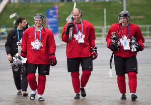 Teammates Chris Kunitz, left, Ryan Getzlaf, centre, and Matt Duchene walk to hockey practice at the 2014 Sochi Winter Olympics in Sochi, Russia on Tuesday, Feb. 18, 2014. (The Canadian Press/Nathan Denette)