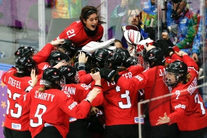 Team Switzerland celebrates their 4-3 win over Sweden in the women's bronze medal ice hockey game at the 2014 Winter Olympics Thursday, Feb. 20, 2014, in Sochi, Russia. (AP Photo/Petr David Josek)
