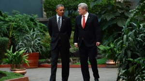 Prime Minister Stephen Harper walks with US President Barack Obama during the North American Leaders Summit in Toluca, Mexico on Wed., Feb. 19, 2014. (The Canadian Press/Sean Kilpatrick)