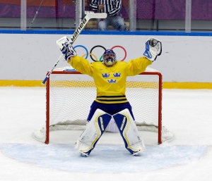 Goaltender Henrik Lundqvist reacts after Sweden defeated Finland in a men's hockey semifinal at the 2014 Winter Olympics Friday, Feb. 21, 2014, in Sochi, Russia. (AP Photo/David J. Phillip_ )