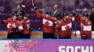 Team Canada's bench erupts in celebration after defeating the United States 1-0 in ice hockey semi-final action at the 2014 Sochi Winter Olympics in Sochi, Russia on Friday, February 21, 2014. (The Canadian Press/Nathan Denette)