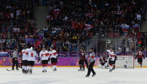 Team Canada celebrates a third period goal against Latvia during a men's quarterfinal ice hockey game at the 2014 Winter Olympics, Wednesday, Feb. 19, 2014, in Sochi, Russia. (AP /Julio Cortez)