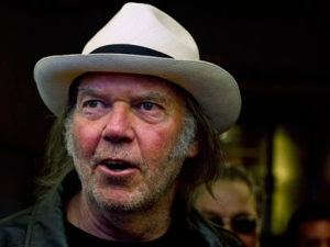 Neil Young talks with people as he arrives for new movie "Neil Young Journeys" at the Toronto International Film Festival in Toronto on Monday, Sept., 12, 2011. (THE CANADIAN PRESS/Nathan Denette)
