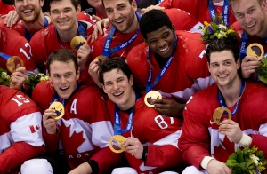 Team Canada captain Sidney Crosby celebrates with other Canada players after defeating Team Sweden to win the gold medal in Olympic final action at the Sochi Winter Olympics Sunday February 23, 2014 in Sochi, Russia. THE CANADIAN PRESS/Paul Chiasson