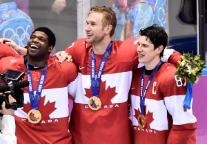Canada teammate P.K. Subban, left, Jeff Cater, centre, and Sidney Crosby, right, celebrate after defeating Sweden for the gold medal at the 2014 Sochi Winter Olympics in Sochi, Russia on Sunday, February 23, 2014. (Nathan Denette/The Canadian Press)