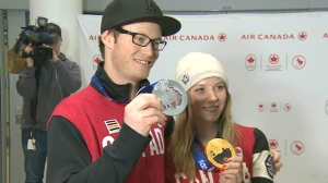 Dara Howell and Mike Riddle pose with their medals from Sochi 2014 at Pearson International Airport on Monday afternoon. 