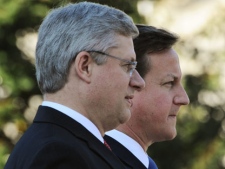 Canadian Prime Minister Stephen Harper pauses with Prime Minister of the United Kingdom David Cameron during a ceremony at the War Memorial in Ottawa, Thursday Sept. 22, 2011. (THE CANADIAN PRESS/Sean Kilpatrick)