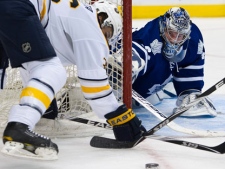 Toronto Maple Leafs goalie James Reimer, right, makes a save on a shot by Buffalo Sabres forward Patrick Kaleta, left, during first period pre-season NHL hockey action in Toronto on Friday, Sept. 23, 2011. (THE CANADIAN PRESS/Nathan Denette)
