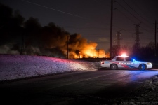 Firefighters battle four-alarm blaze at auto shop