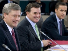 Prime Minister Stephen Harper, Minister of Finance Jim Flaherty and Bank of Canada Governor Mark Carney