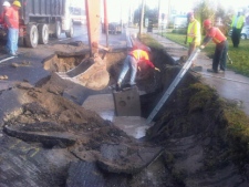Crews repair a large sinkhole that opened up on Woodbine Avenue, between Denison and John streets, on Wednesday, Sept. 28, 2011. (CP24/Cam Woolley)