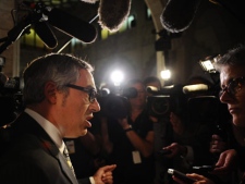 Treasury Board President Tony Clement speaks to reporters in the foyer of the House of Commons following question period on Parliament Hill in Ottawa on Monday, September 19, 2011. (THE CANADIAN PRESS/Sean Kilpatrick)