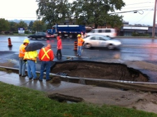 A large sinkhole opened up on Woodbine Avenue, between Denison and John streets, on Wednesday, Sept. 28, 2011. (CP24/Mathew Reid)