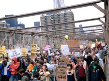 In this Oct. 1, 2011 photo, protesters walk onto New York's Brooklyn Bridge before police began making arrests during Saturday's march by Occupy Wall Street. Protesters speaking out against corporate greed and other grievances attempted to walk over the bridge from Manhattan, resulting in the arrest of more than 700 during a tense confrontation with police. The majority of those arrested were given citations for disorderly conduct and were released, police said. (AP Photo/Stephanie Keith)