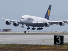 A Lufthansa Airlines A380, the world's largest passenger aircraft, lands at San Francisco International Airport in San Francisco on Tuesday, May 10, 2011. (AP Photo/Eric Risberg)