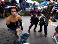 Occupy Wall Street protestors play drums and sing songs in the financial district's Zuccotti park Sunday, Oct. 2, 2011, in New York. (AP Photo/John Minchillo)
