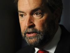 New Democratic Party MP Thomas Mulcair speaks to reporters in the foyer of the House of Commons on Parliament Hill in Ottawa on Tuesday, September 27, 2011. (THE CANADIAN PRESS/Sean Kilpatrick)