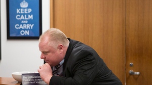 Toronto Mayor Rob Ford leans on a desk outside his office at city hall in Toronto on Wednesday, March 19, 2014. THE CANADIAN PRESS/Chris Young