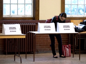 A woman casts her ballot at a voting station in Toronto during the Ontario provincial election Thursday, Oct. 6, 2011. THE CANADIAN PRESS/Chris Young.